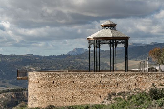 viewpoint over a mountainous landscape with cloudy sky in the city of ronda malaga