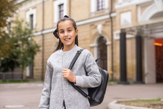 Cute girl with backpack going to school.
