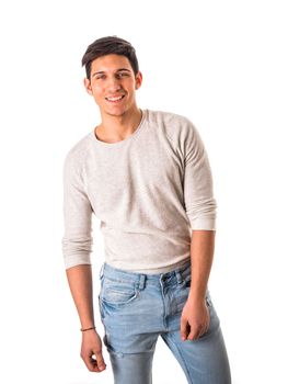 Smiling cool young man with wool sweater on white background looking at camera