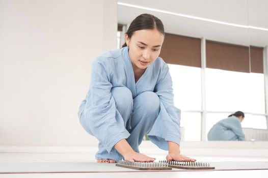 Asian woman folded her palms on sadhu boards