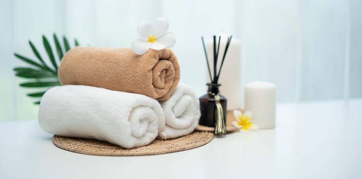 Spa accessory composition set in day spa hotel , beauty wellness center . Spa product are placed in luxury spa resort room , ready for massage therapy from professional service .