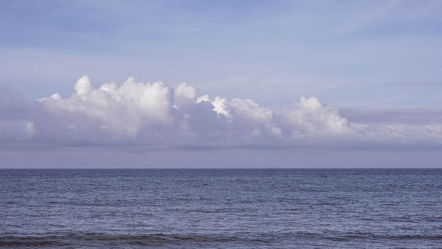 Atmosphere panorama real photo beautiful summer white cloud clear pale blue purple tone sky horizon line calm empty sea. Concept paradise life. Design relax wallpaper background. More format in stock.