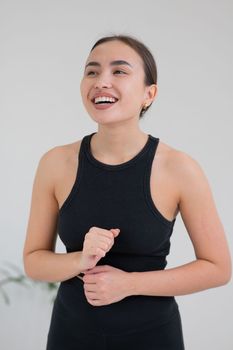 Portrait of a smiling Asian woman on a white background