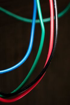 Multi colored wires on an electronic device, close up