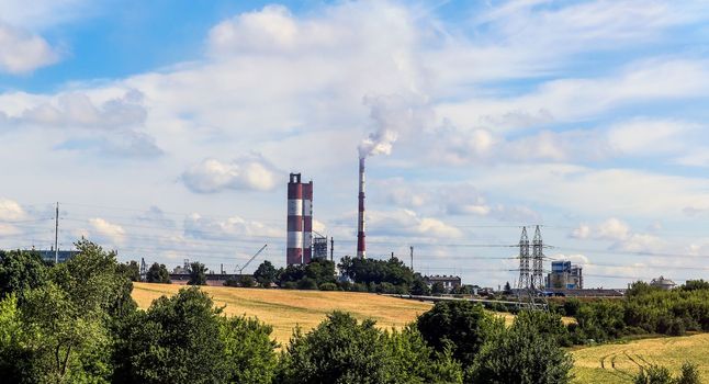 chemical plant among sown fields, production of chemicals. environmentally friendly production.