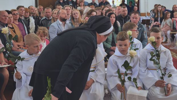 Children in church at their First Catholic Communion.