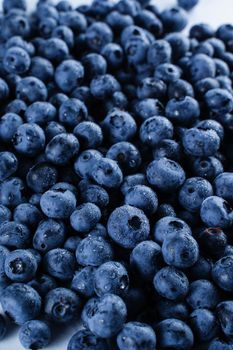 Blueberries with water drops. Blueberry summer seasonal berry. Many natural organic blueberries