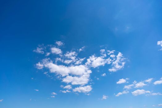 High cirrus clouds against the blue sky.