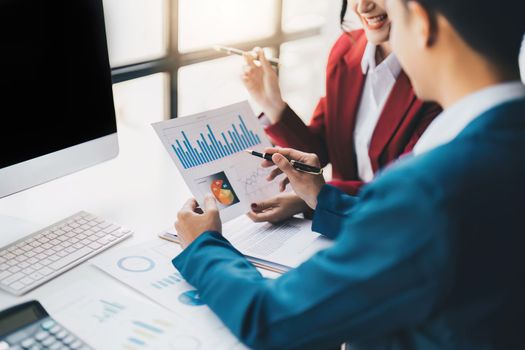 Beautiful business woman consultant talking with asian business person at meeting room with new financial market. Accounting concept.