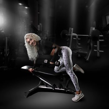 Fitness woman working out in gym doing exercise . Athletic girl training. Beautiful fitness woman lifting dumbbells . Fitness sporty woman showing her well trained body . A beautiful girl's. High quality photo