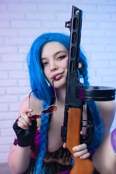 sexy girl in a bright image with a gun in her hands on a neon background