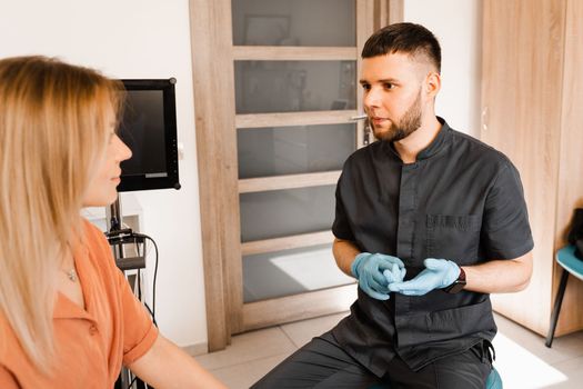 ENT doctor explain patient causes of difficulty breathing. Consultation of woman with otolaryngologist in a medical clinic