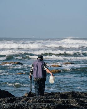 Man shellfisher, seafood seeker in Espinho , Portugal