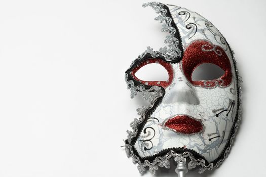 venetian carnival mask on white background close-up and copy space