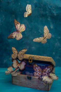 artificial butterflies flying on a blue background