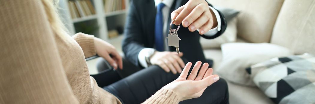 Agent hands over keys to accommodation of persons in wheelchair. Getting social housing concept