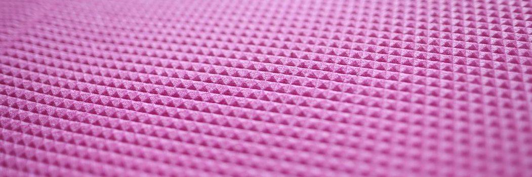 Pink texture of a sports mat and rubber pattern for background. Pink texture in rhombuses concept