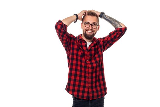 Handsome man model studio portrait. Boy casual style, trendy hipster in checkered shirt look with cool hairstyle. Studio shot on white background. Copy space