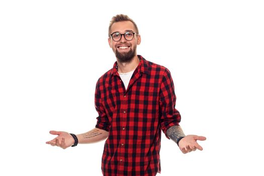 Handsome man model studio portrait. Boy casual style, trendy hipster in checkered shirt look with cool hairstyle. Studio shot on white background. Copy space