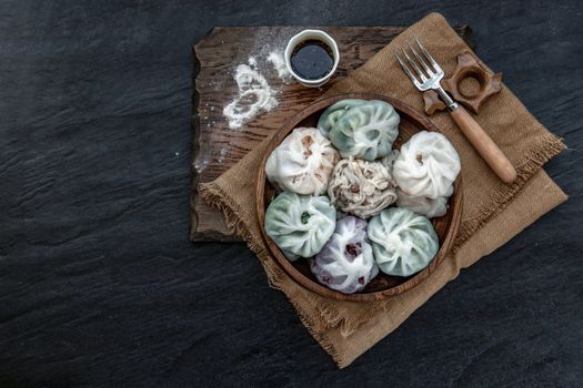 Chinese chives Dumplings Mixed Color or Garlic Chives Dim Sum Rice Cake inside with Taro Slice ,Bamboo shoot and Many kind of vegetable inside the flour, Steamed Served Sweet Black Soy Sauce Chinese Food Style side view, Chinese Food Appetizer dish Style, Top view.