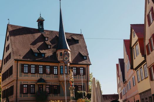 Old national German town house. Old Town is full of colorful and well preserved buildings. Baden-Wurttemberg is a state in southwest Germany bordering France and Switzerland. The Black Forest, known for its evergreen scenery and traditional villages, lies in the mountainous southwest. Stuttgart, the capital, is home to Wilhelma, a royal estate turned zoo and gardens. Porsche and Mercedes-Benz have headquarters and museums there. The 19th-century Hohenzollern Castle sits in the Swabian Alps to the south.