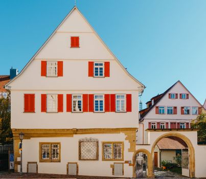 Old national German town house. Old Town is full of colorful and well preserved buildings. Baden-Wurttemberg is a state in southwest Germany bordering France and Switzerland. The Black Forest, known for its evergreen scenery and traditional villages, lies in the mountainous southwest. Stuttgart, the capital, is home to Wilhelma, a royal estate turned zoo and gardens. Porsche and Mercedes-Benz have headquarters and museums there. The 19th-century Hohenzollern Castle sits in the Swabian Alps to the south.