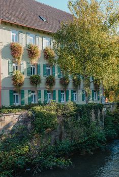 Old national German town house. Old Town is full of colorful and well preserved buildings. Baden-Wurttemberg is a state in southwest Germany bordering France and Switzerland. The Black Forest, known for its evergreen scenery and traditional villages, lies in the mountainous southwest. Stuttgart, the capital, is home to Wilhelma, a royal estate turned zoo and gardens. Porsche and Mercedes-Benz have headquarters and museums there. The 19th-century Hohenzollern Castle sits in the Swabian Alps to the south.