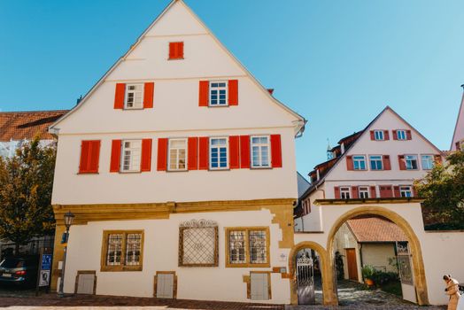 Old national German town house. Old Town is full of colorful and well preserved buildings. Baden-Wurttemberg is a state in southwest Germany bordering France and Switzerland. The Black Forest, known for its evergreen scenery and traditional villages, lies in the mountainous southwest. Stuttgart, the capital, is home to Wilhelma, a royal estate turned zoo and gardens. Porsche and Mercedes-Benz have headquarters and museums there. The 19th-century Hohenzollern Castle sits in the Swabian Alps to the south.