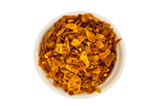 Dried chilli paste with crispy shrimp thai style or Crispy shrimp chilli paste in ceramic white cup isolated on white background with clipping path. Top view, Selective focus.