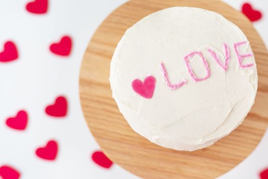 Bento cake with the inscription Love and hearts. A small Korean cake for one person. A cute dessert gift for a loved one for any holiday. Valentine's Day