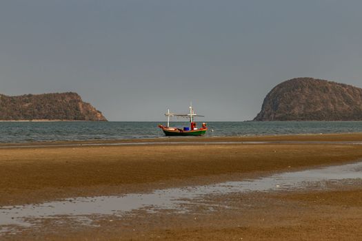 Thai fishing boat used as a vehicle for finding fish in the sea. Selective focus.