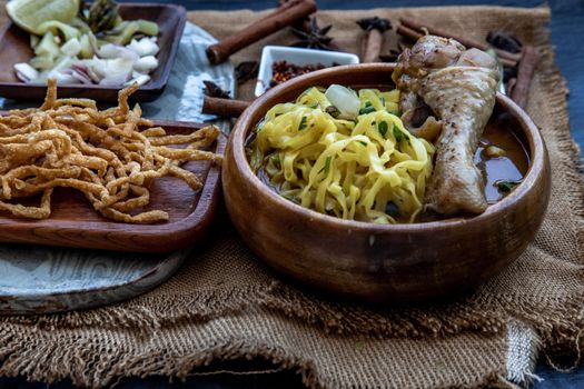 Close-up of Northern Style Curried Noodle Soup with coconut milk (Khao soi), Traditional of Northern Thai cuisine.