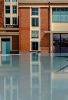 Bangkok, Thailand - Nov 15, 2020 : Siriraj Bimuksthan Museum with reflections in the water. Vintage-style building. Selective focus.