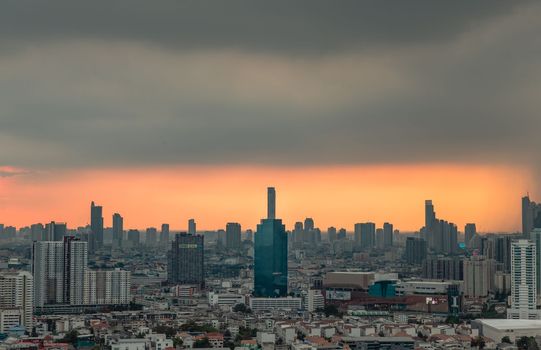 Bangkok, Thailand - May 09, 2021 : Aerial view of Beautiful scenery view of Skyscraper Evening time before Sunset creates relaxing feeling for the rest of the day. Selective focus.