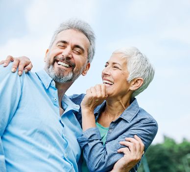 portrait of happy smiling senior couple outdoors