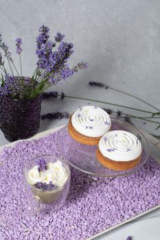 Two mousse cakes decorated with lavender flowers and matcha green tea. High quality photo
