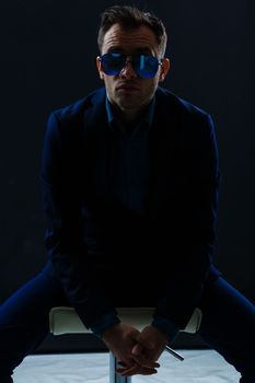 businessmen modern style suit fashion sunglasses dark background