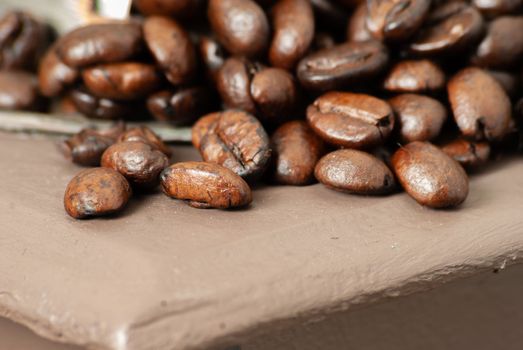 roasted coffee beans on a wood background