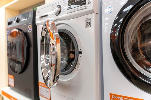 Sosnovy Bor, RUSSIA - JANUARY 12, 2023: household appliances in DNS store, washing machines. High quality photo