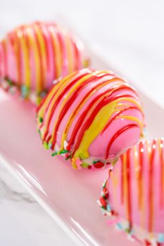 Christmas hot chocolate bombs on a white plate.