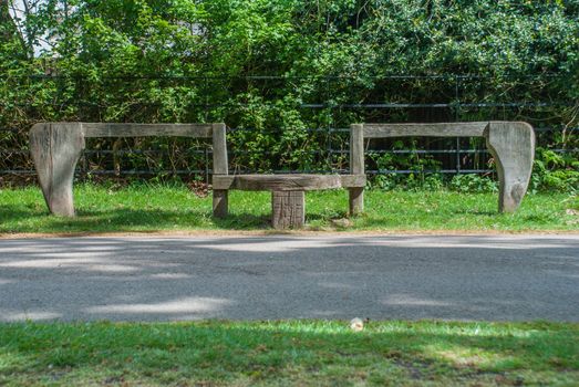 Old wooden seats during a walk in the garden