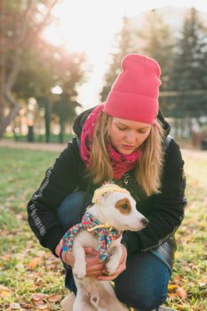 Woman walking Jack Russell Terrier and Brussels Griffon dogs in park