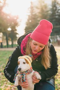 Woman walking Jack Russell Terrier and Brussels Griffon dogs in park