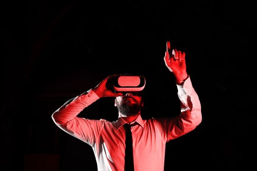 Man Wearing Vr Glasses And Pointing On Important Messages With One Finger.