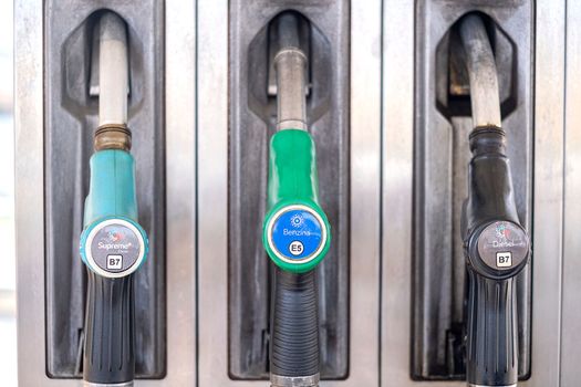 Service gas station with fuel, oil, gasoline and diesel. Close-up of a gas pump fueling gun. Petrol station. Italy