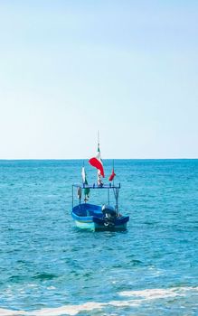 Boat yacht ship pier and harbor at the tropical mexican beach panorama view in Puerto Escondido zicatela Oaxaca Mexico.