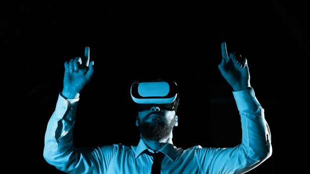 Man Wearing Vr Glasses And Pointing On Important Messages With two Fingers.