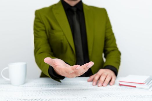 Businessman in jacket Holding Important Message In One Hand.