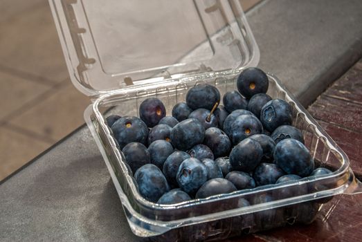 Black grapes in plastic boxes ready to eat