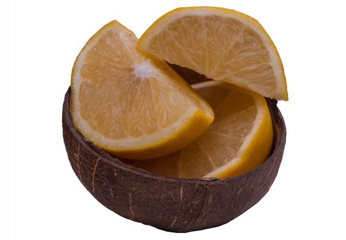 Fresh Grapefruit in a coconut shell on a white background.